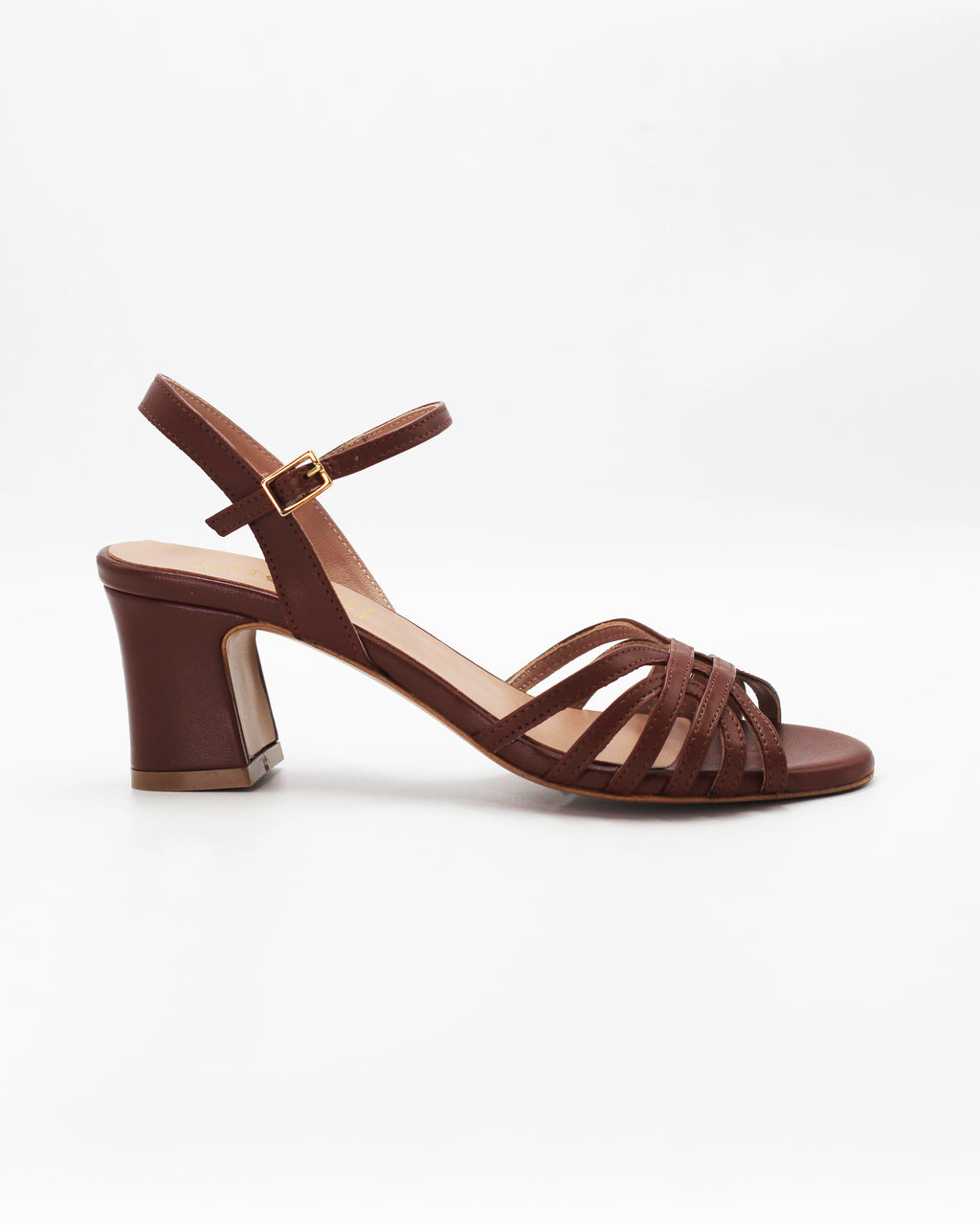 Shop the RIVOLI19 block heel sandal in brown calf leather. Italian-made with a woven strap detail, adjustable ankle strap, and rubber sole. Elevated summer elegance.