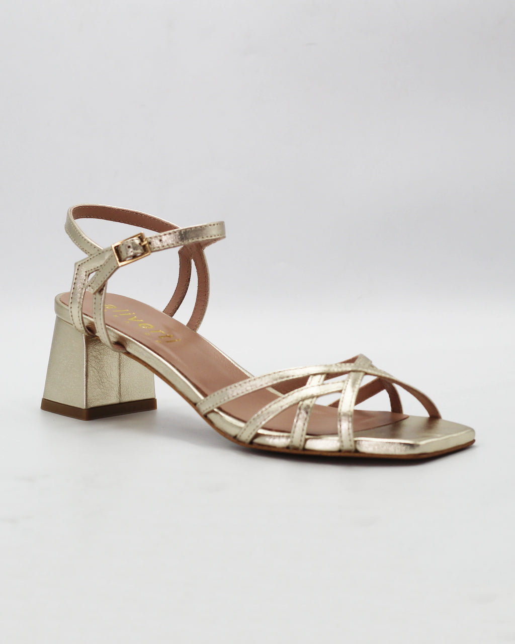 Shop the OPERA6 block heel sandal in shimmering platino calf leather. Strappy upper, secure ankle strap, and a comfortable rubber sole, made in Italy. Party-perfect.