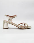 Shop the OPERA6 block heel sandal in shimmering platino calf leather. Strappy upper, secure ankle strap, and a comfortable rubber sole, made in Italy. Party-perfect.