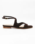 PATTY20 flat sandal in testa di moro suede with a sleek asymmetric toe strap and adjustable ankle strap. Handcrafted in Italy. Understated and easy.