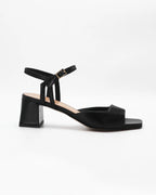 Shop the OPERA11 block heel sandal in black calf leather. Italian-made with an adjustable ankle strap and durable rubber sole. Effortless everyday elegance.