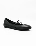 Elegant black ballerina pumps in Nero calf leather with a delicate lace-up bow. Handcrafted in Italy with a durable rubber sole. Timeless everyday luxury.