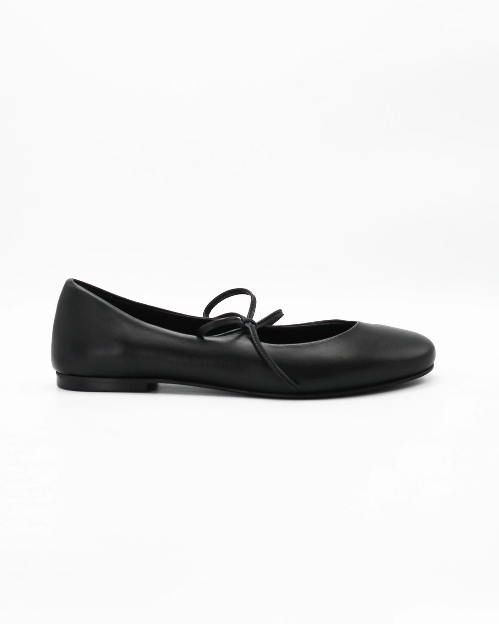 Elegant black ballerina pumps in Nero calf leather with a delicate lace-up bow. Handcrafted in Italy with a durable rubber sole. Timeless everyday luxury.