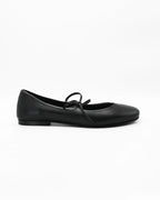 Elegant black ballerina pumps in Nero calf leather with a delicate lace-up bow. Handcrafted in Italy with a durable rubber sole. Timeless everyday luxury.