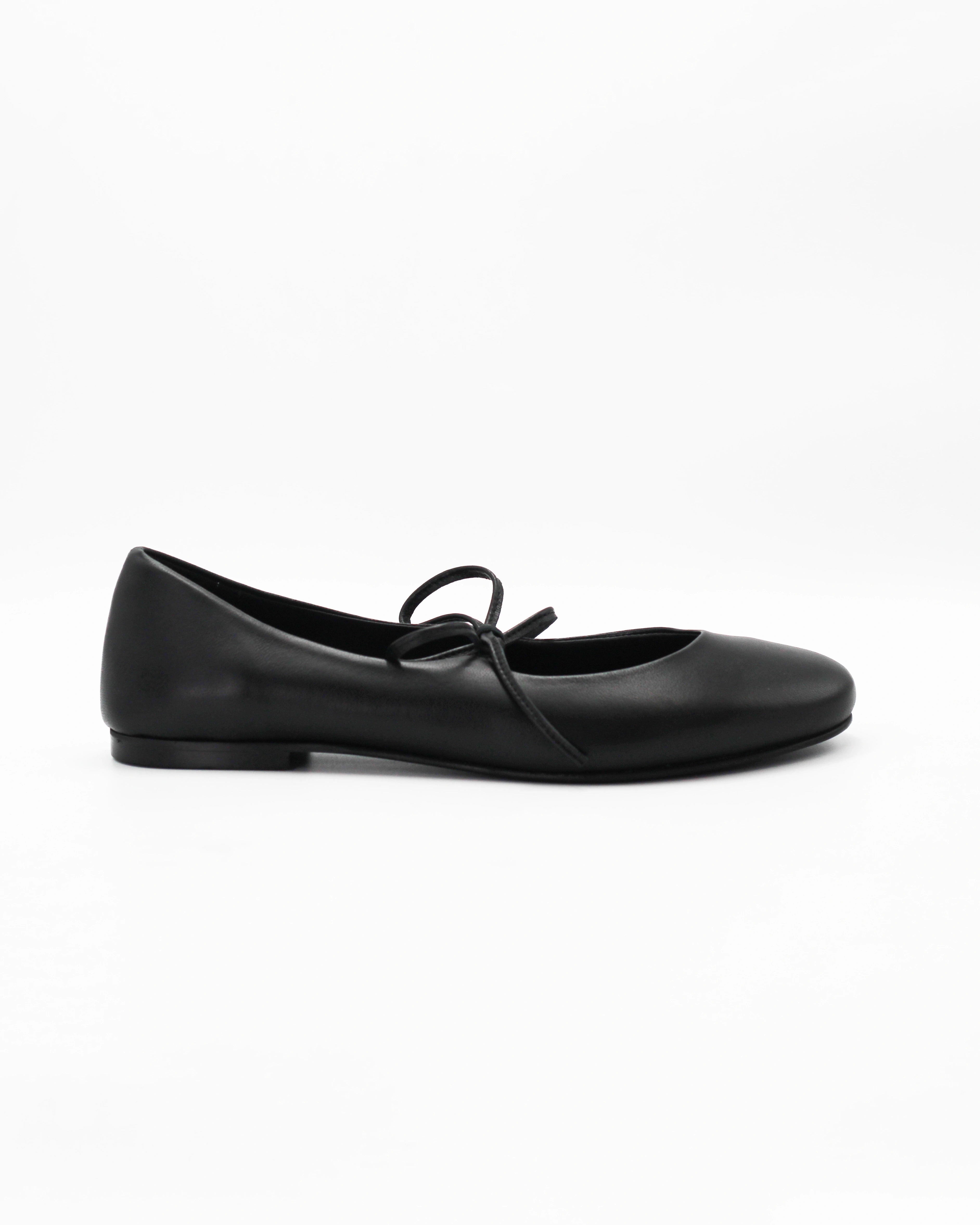 Elegant black ballerina pumps in Nero calf leather with a delicate lace-up bow. Handcrafted in Italy with a durable rubber sole. Timeless everyday luxury.