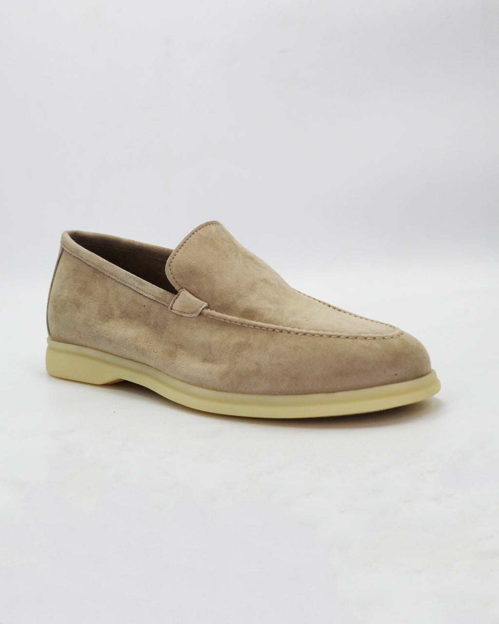 Shop the UO32017 slip-on loafer in seppia suede calf leather. Italian-made with a soft unstructured silhouette and rubber sole. Refined everyday elegance. 