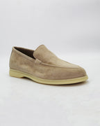Shop the UO32017 slip-on loafer in seppia suede calf leather. Italian-made with a soft unstructured silhouette and rubber sole. Refined everyday elegance. 