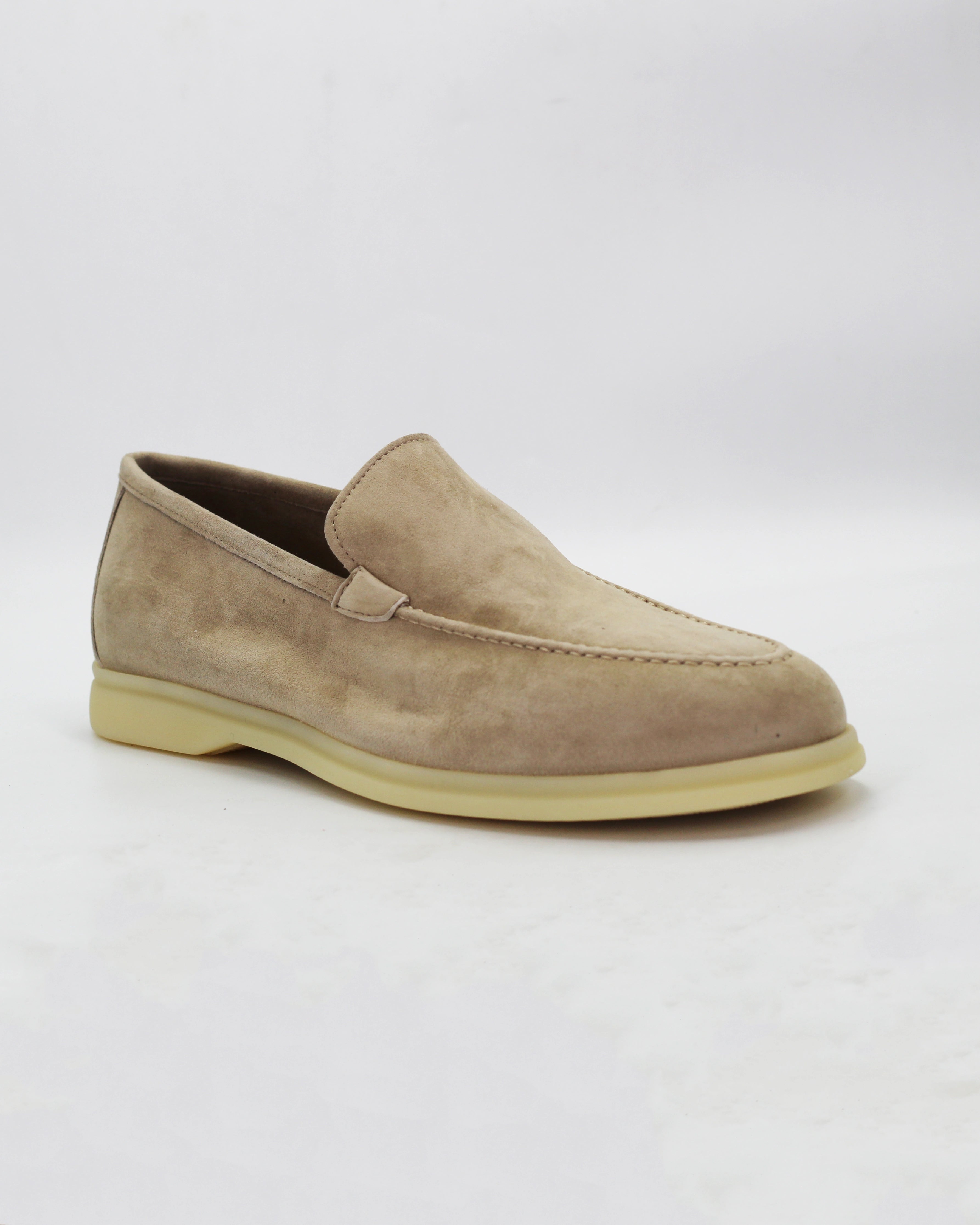 Shop the UO32017 slip-on loafer in seppia suede calf leather. Italian-made with a soft unstructured silhouette and rubber sole. Refined everyday elegance. 