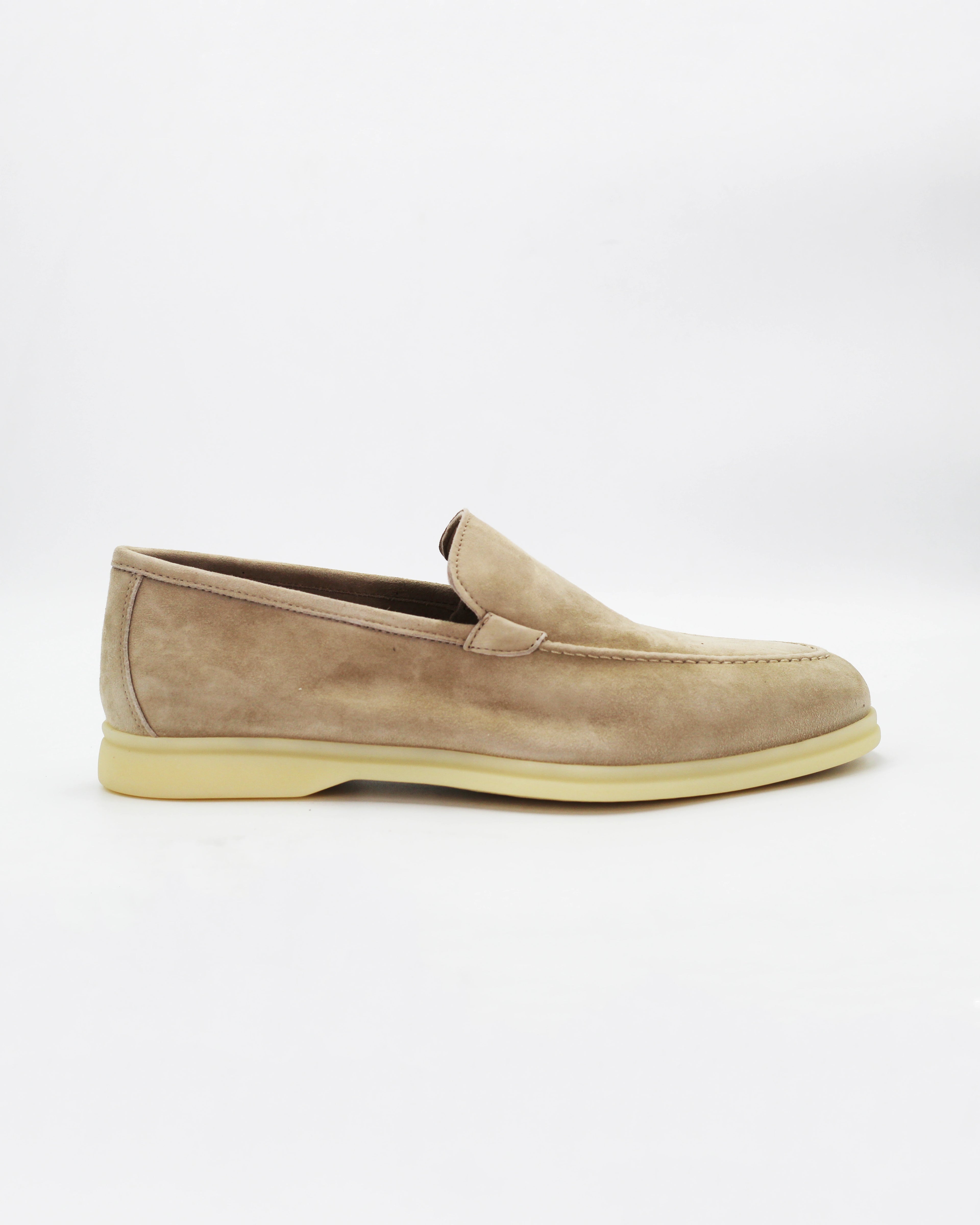 Shop the UO32017 slip-on loafer in seppia suede calf leather. Italian-made with a soft unstructured silhouette and rubber sole. Refined everyday elegance.
