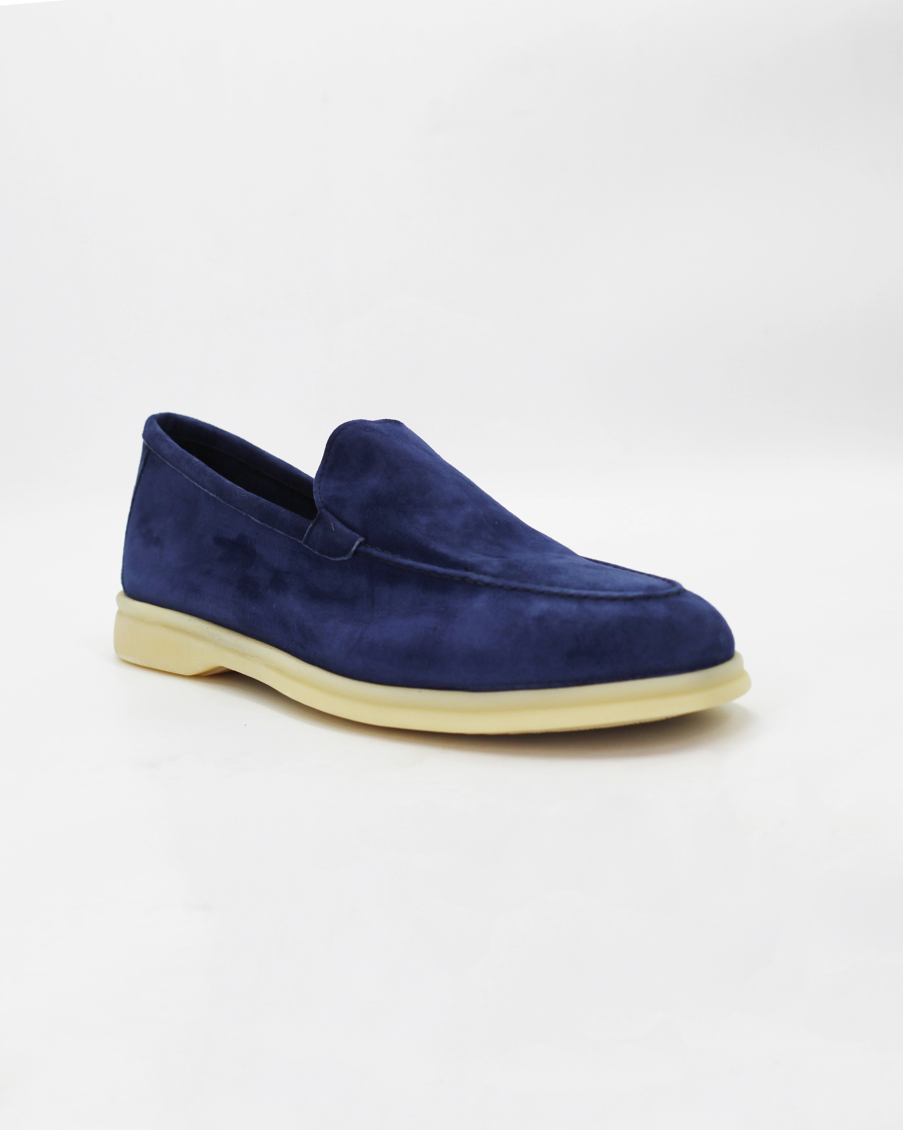 Shop the UO32017 slip-on loafer in blue suede calf leather. Italian-made with a soft unstructured silhouette and rubber sole. Refined everyday elegance.