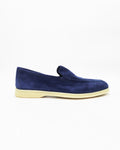 Shop the UO32017 slip-on loafer in blue suede calf leather. Italian-made with a soft unstructured silhouette and rubber sole. Refined everyday elegance.