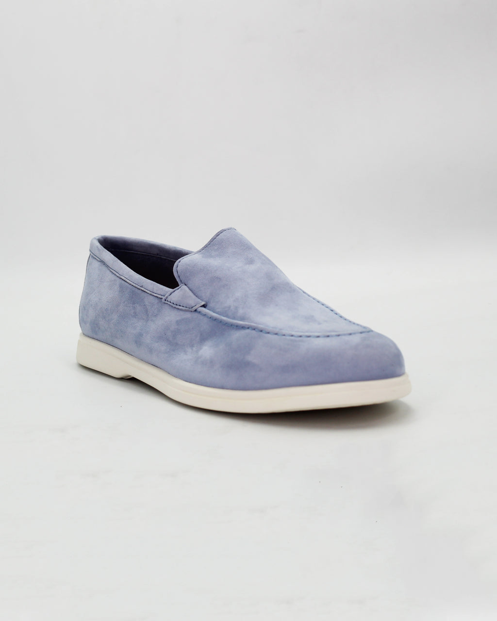 Shop the D032018 slip-on loafer in light blue suede calf leather. Italian-made with a soft unstructured silhouette and rubber sole. Relaxed everyday elegance.