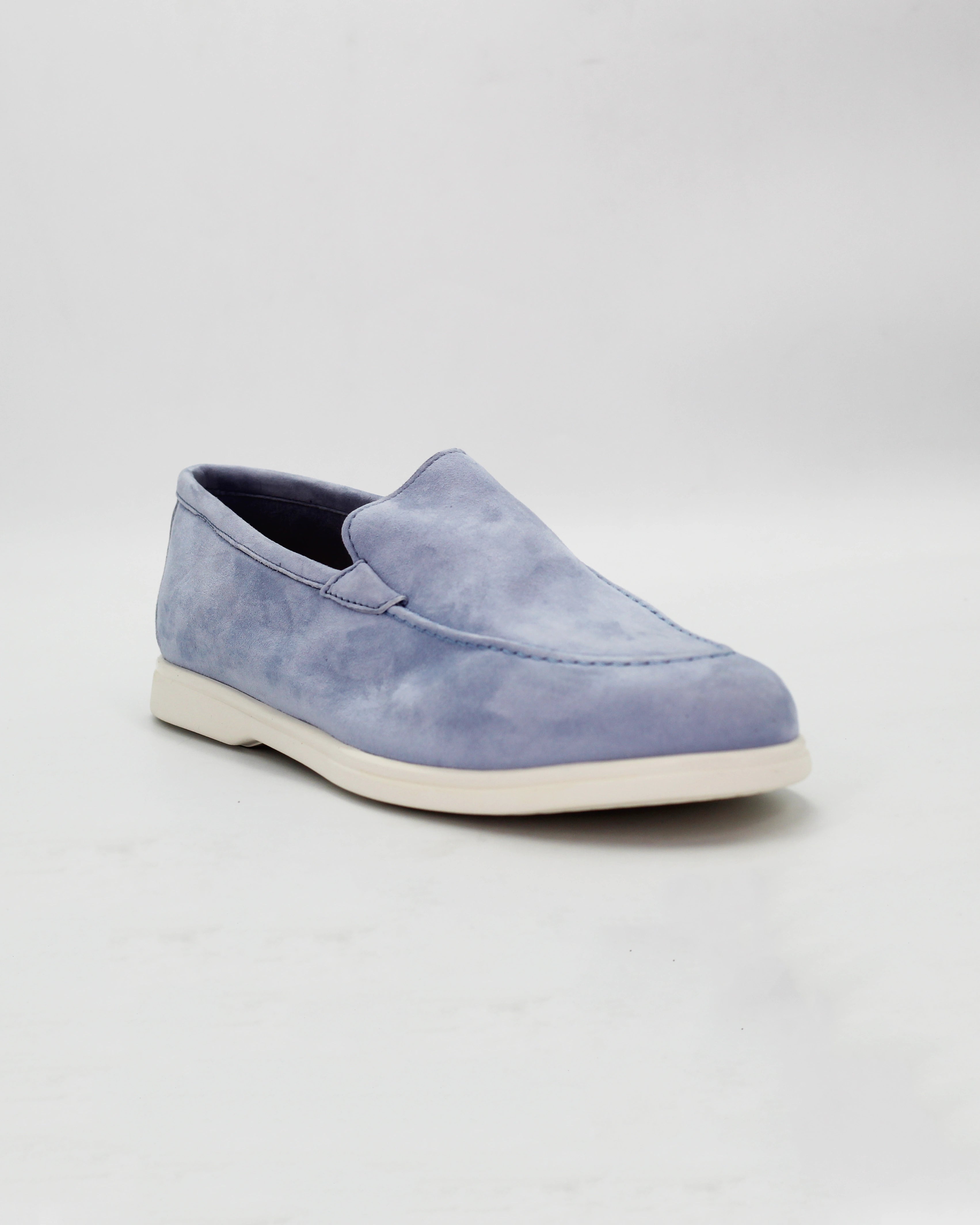 Shop the D032018 slip-on loafer in light blue suede calf leather. Italian-made with a soft unstructured silhouette and rubber sole. Relaxed everyday elegance.