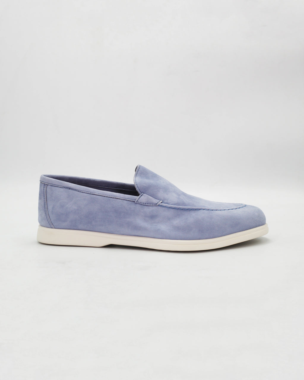Shop the D032018 slip-on loafer in light blue suede calf leather. Italian-made with a soft unstructured silhouette and rubber sole. Relaxed everyday elegance.