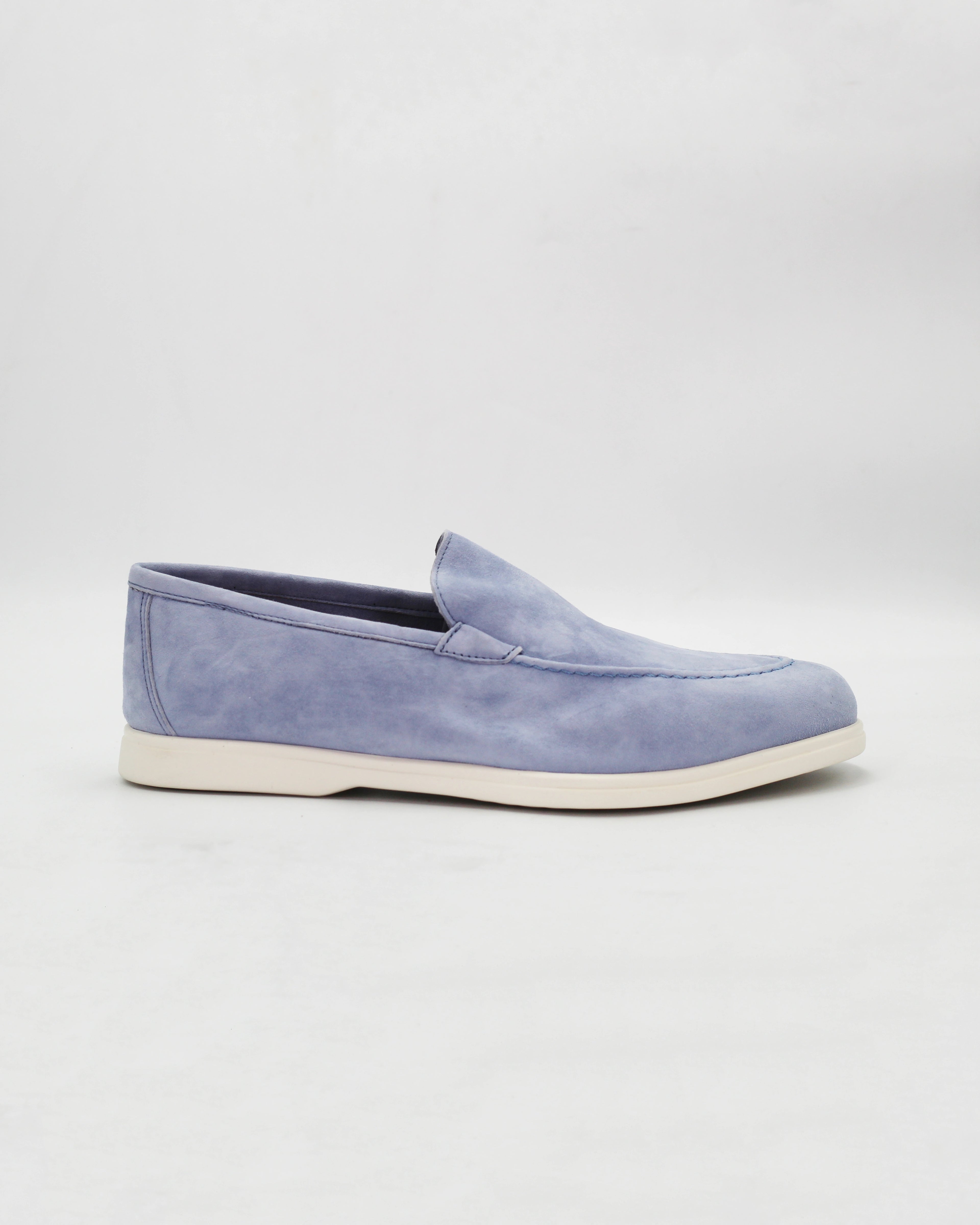 Shop the D032018 slip-on loafer in light blue suede calf leather. Italian-made with a soft unstructured silhouette and rubber sole. Relaxed everyday elegance.