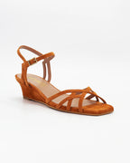 LYA8 wedge sandal in tangerine suede with delicate woven straps and an adjustable ankle strap. Handcrafted in Italy. Soft lift, all-day comfort.