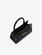 Mini bag made of precious lambskin with a crumpled effect and a delicate glossy finish, with double handles and a removable leather shoulder strap.
The bag is embellished on both the front and back with the iconic Tramontano archive accessory, in handcrafted gold-plated brass.
Top closure with magnet.

Microfiber lining.&nbsp;Gold-finish accessories.

Material:&nbsp;Moon lamb
Dimensions:&nbsp;25x13x10.5 cm