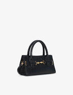 Mini bag made of precious lambskin with a crumpled effect and a delicate glossy finish, with double handles and a removable leather shoulder strap.
The bag is embellished on both the front and back with the iconic Tramontano archive accessory, in handcrafted gold-plated brass.
Top closure with magnet.

Microfiber lining.&nbsp;Gold-finish accessories.

Material:&nbsp;Moon lamb
Dimensions:&nbsp;25x13x10.5 cm