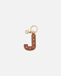 Your initial, in leather. Handcrafted by Cuoieria Fiorentina in Florence from soft full-grain calfskin - treated to a fine, uniform grain that feels as good as it looks. Gold-finish studs, a gold carabiner clip, and the kind of quiet personalisation that says exactly what it needs to without saying a word. Made in Italy. Made to be yours.
