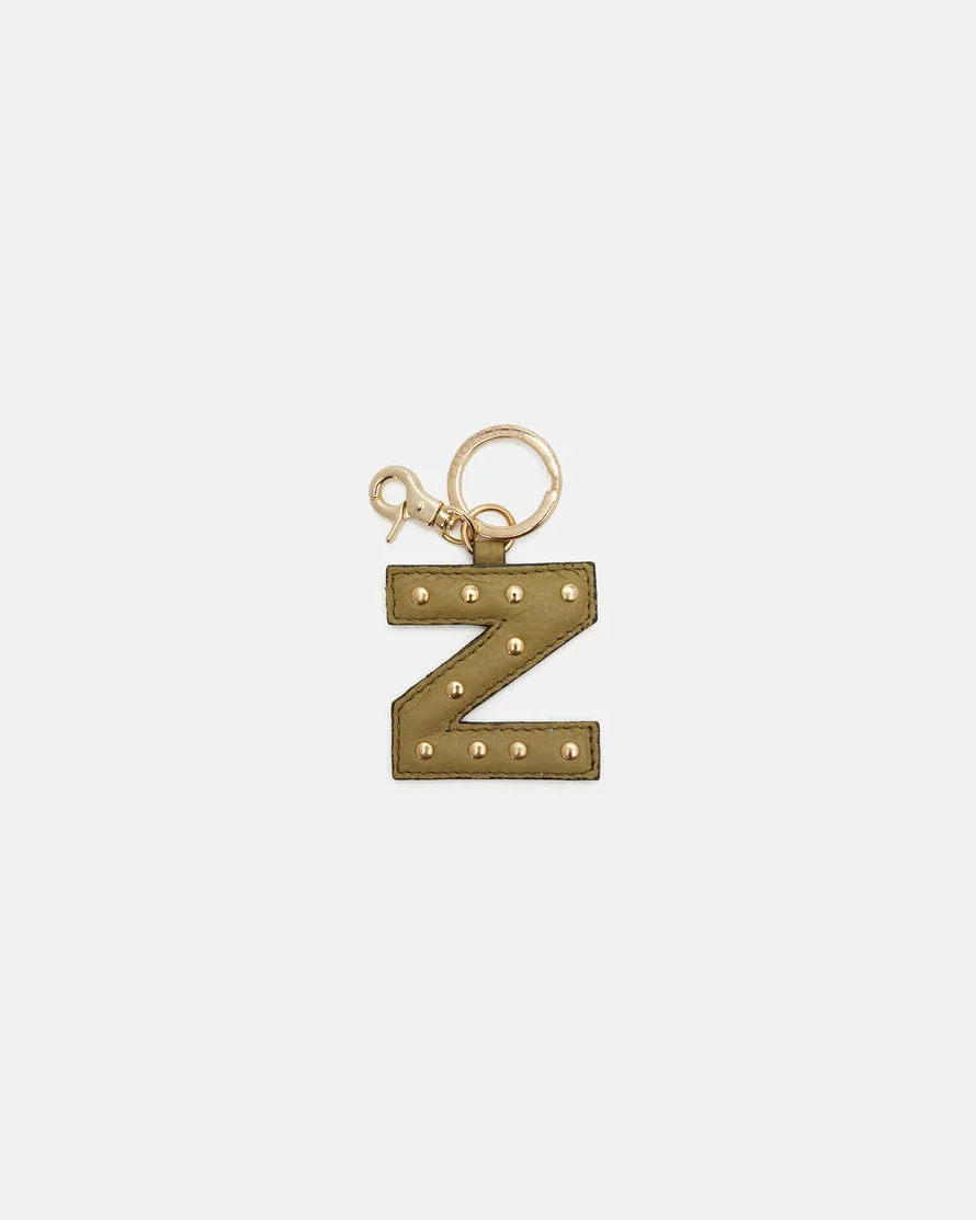 Your initial, in leather. Handcrafted by Cuoieria Fiorentina in Florence from soft full-grain calfskin - treated to a fine, uniform grain that feels as good as it looks. Gold-finish studs, a gold carabiner clip, and the kind of quiet personalisation that says exactly what it needs to without saying a word. Made in Italy. Made to be yours.