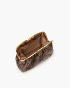 Clutch made of precious snake leather, finished with a golden metal closure, personalized Tramontano.
The bag can be worn on the shoulder thanks to the removable leather shoulder strap.
Unique internal compartment with small leather pocket.

Microfiber inner lining.
Accessories with gold finish.

Material: Snake Elaphe
Dimensions: 26x15X8