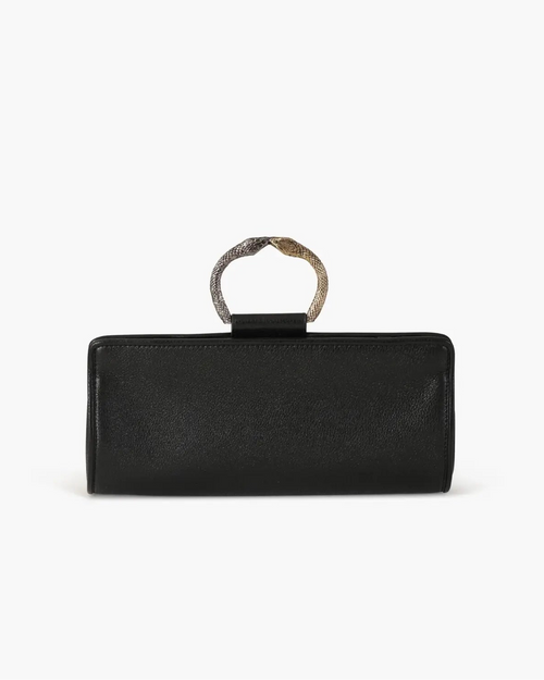 Laminated leather clutch with rounding rigid body and removable leather strail strap.Brass double-sided braceletDouble gold and silver color, iconic accessory of the Tramontano archive handcrafted. Top closure with double magnets. Microfiber lining. Accessories in silver finish. Material: shimmer calfDimensions: 31x12x8 cm