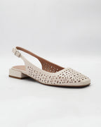 Shop the DARIA95 slingback flat in cream calf leather. Italian-made with laser cut-out detailing, an adjustable slingback strap, and rubber sole. Timeless everyday elegance.