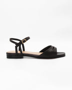 PATTY26 flat two-strap sandal in testa di moro calf leather with a soft cut-out toe strap and adjustable ankle strap. Handcrafted in Italy. Easy everyday wear.