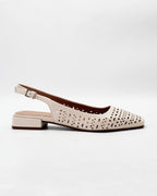 Shop the DARIA95 slingback flat in cream calf leather. Italian-made with laser cut-out detailing, an adjustable slingback strap, and rubber sole. Timeless everyday elegance.